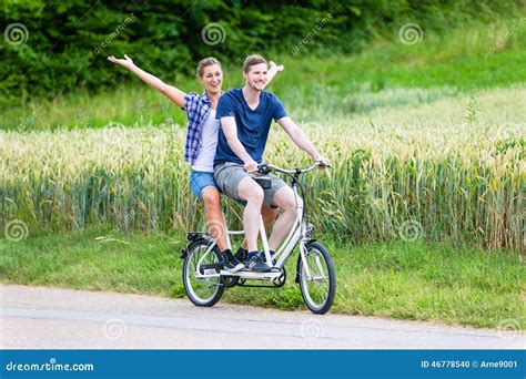 Couple Riding Tandem Bike Together In The Country Stock Photo Image