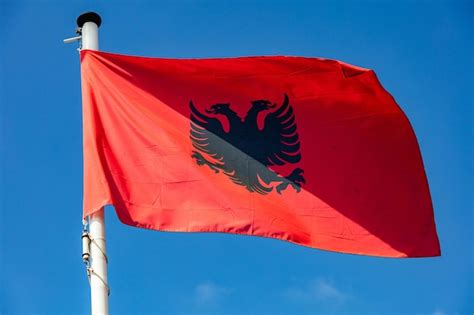 Premium Photo Albanian Flag Waving Against Clear Blue Sky