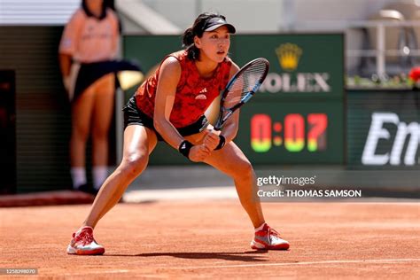 Chinas Wang Xinyu Returns The Ball To Polands Iga Swiatek During