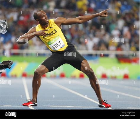 Usain Bolt Of Jamaica Strikes His Signature Lightning Bolt Pose After