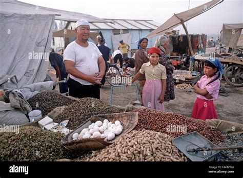 Uyghur Father And Daughters Selling Nuts Spices And Eggs Turpan