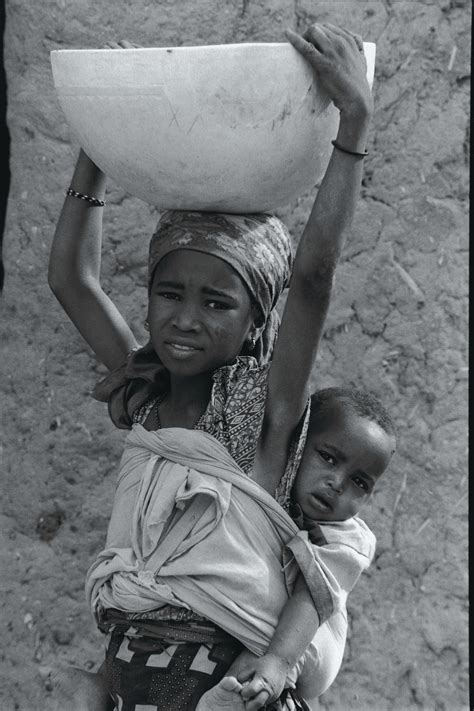 African Woman Carrying Water