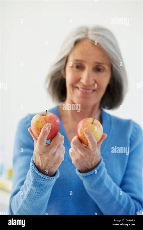 ELDERLY PERSON EATING FRUIT Stock Photo - Alamy