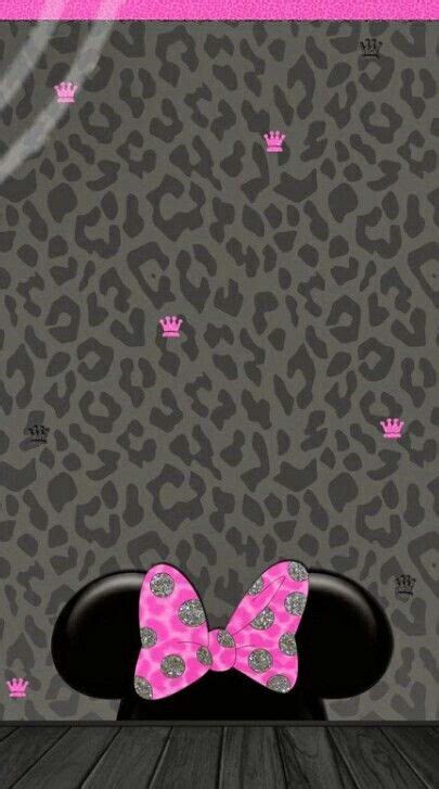 A Pink Bow Sitting On Top Of A Black Chair In Front Of A Leopard Print Wall