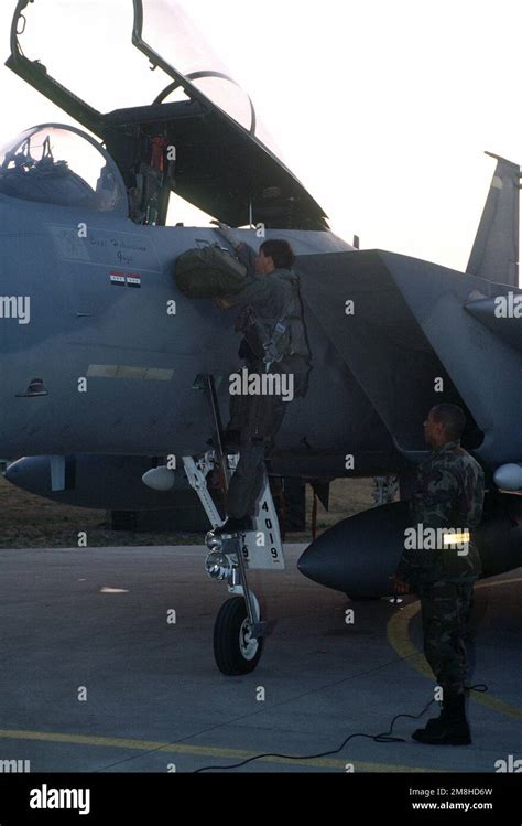 A 53rd Fighter Squadron Pilot Climbs Into The Cockpit Of His F 15C