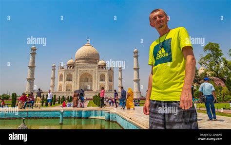 Traveler And Tourist Poses In Front Of The Famous Taj Mahal In Agra