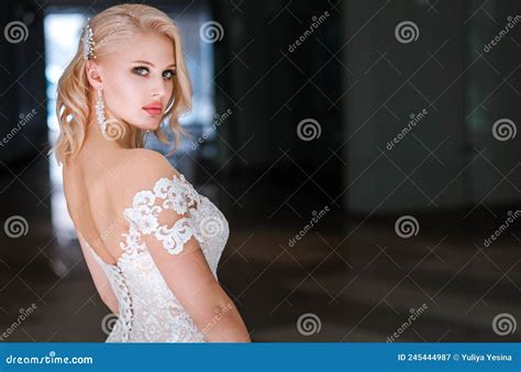 Luxurious Blonde Bride In A Wedding Dress Is Posing For The Camera Stock Image Image Of