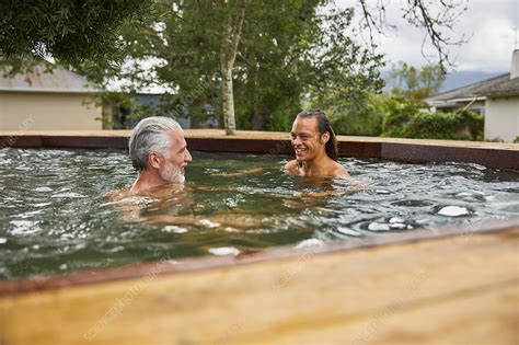 Father And Son Relaxing In Hot Tub Stock Image F Science Photo Library