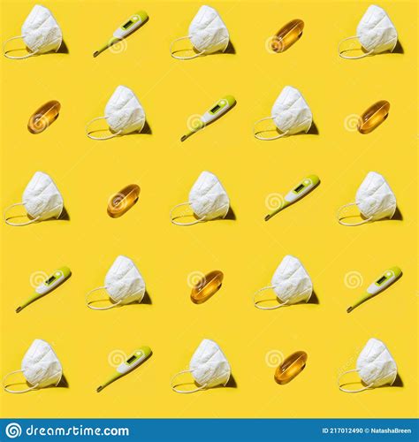 White Medicine Respirator KN95 Mask Pattern Over Yellow Stock Photo