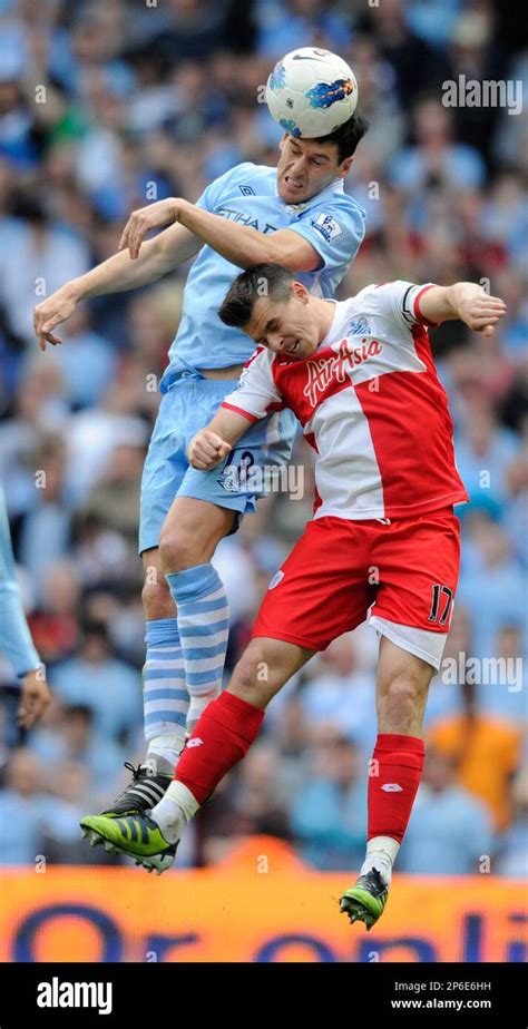 Gareth Barry Of Manchester City Tussles With Joey Barton Of QPR