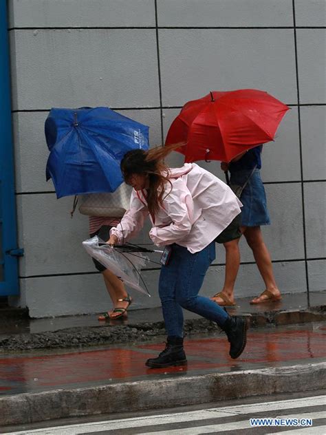 People Brave Strong Winds Heavy Rain In Quezon City Xinhua English