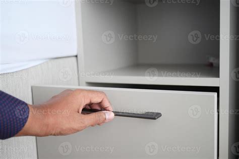 Man S Hand Open Drawer Wooden In Cabinet Stock Photo At Vecteezy