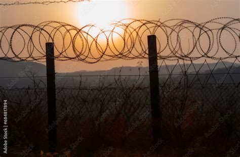 Border of South Kore and North Korea. Border with barbed wire on fence ...