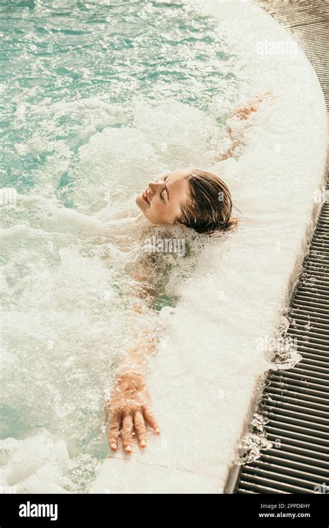 Smiling Woman Relaxing In Hot Tub Stock Photo Alamy