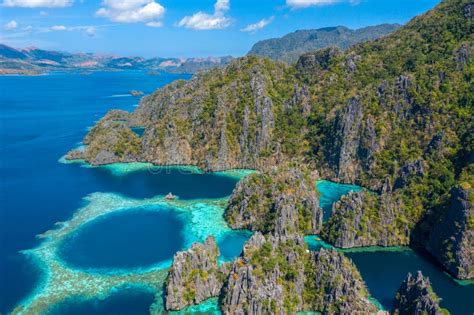 Aerial View Of Turquoise Tropical Lagoon With Limestone Cliffs In Coron