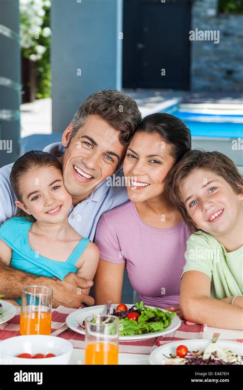 Family in big house Stock Photo - Alamy