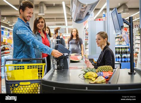 People Buying Goods In A Grocery Store Stock Photo Alamy