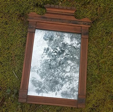 Antique Wooden Framed Wall Mirror With Carved Details and Vintage Patina on the Frame and Mirror