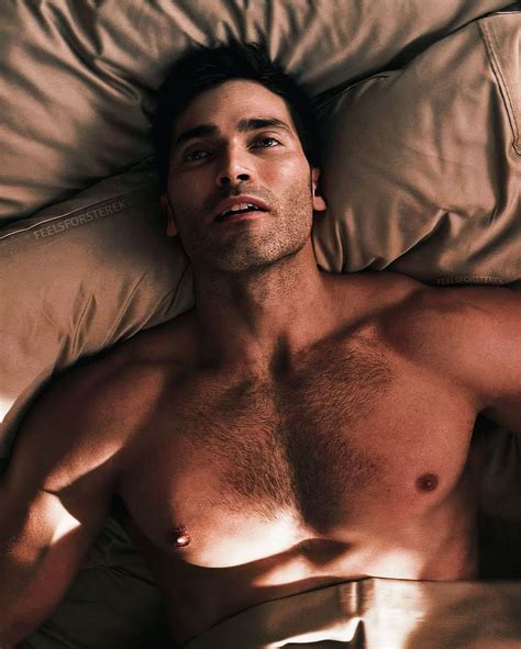 A Shirtless Man Laying In Bed With His Eyes Closed