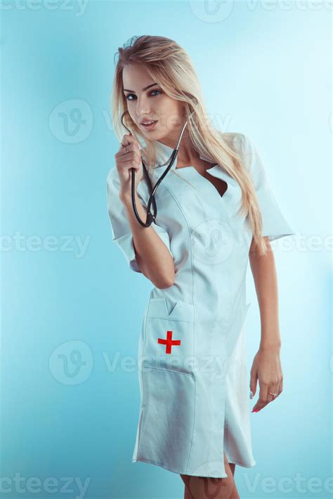 Sweet Blonde Nurse With Stethoscope In White Medical Gown 16518639 Stock Photo At Vecteezy