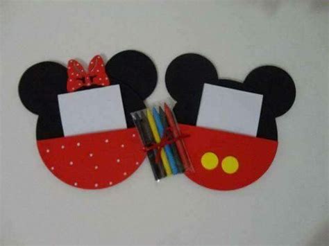 Two Mickey Mouse Magnets With Pens In Them