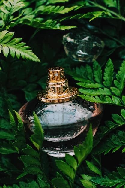 Premium Photo | Perfume bottle with aromatic tropical scent in nature ...