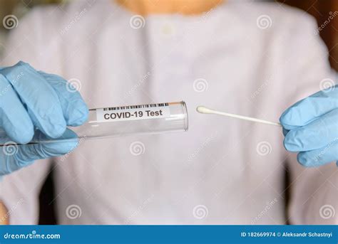 Medical Worker Holding Swab Sample Collection Kit Test Tube For