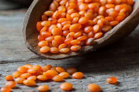 Red Lentils In Wooden Spoon On Wooden Background Stock Photo Image Of