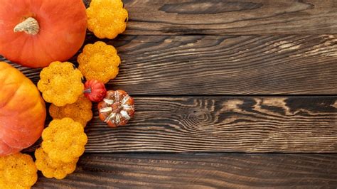 Free Photo Flat Lay Colourful Pumpkins On Wooden Background