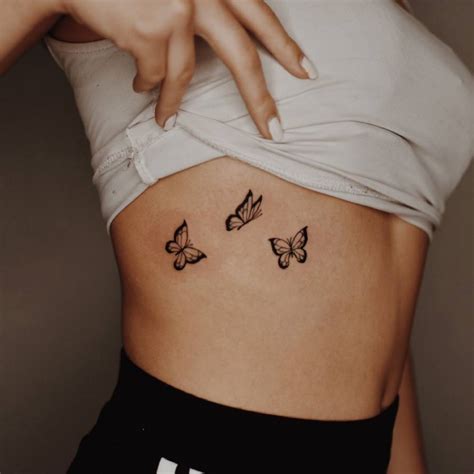 Butterflies Tattoo On The Rib