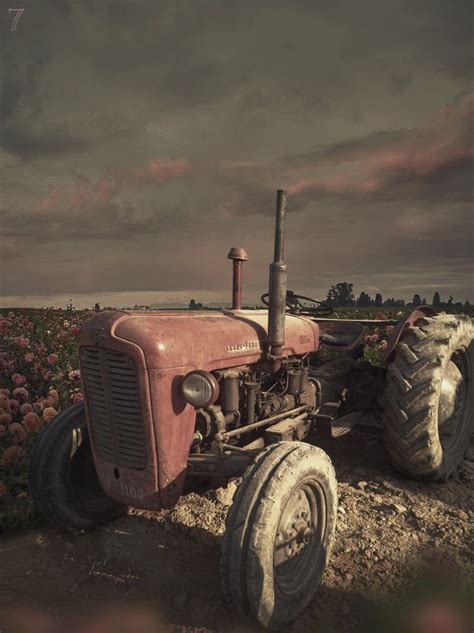 A Tractor In The Field At The Cloudy Sunset Tractors Tractor