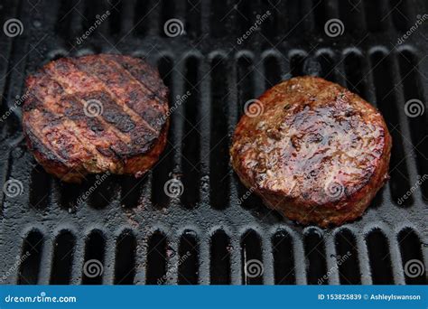 Two Hamburgers On A Barbeque Grill Stock Image Image Of Heat Cook