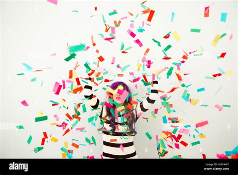 Woman Throwing Colorful Confetti Stock Photo Alamy