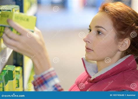 Store Shelf Filler Inspecting Product Stock Photo Image Of Handle