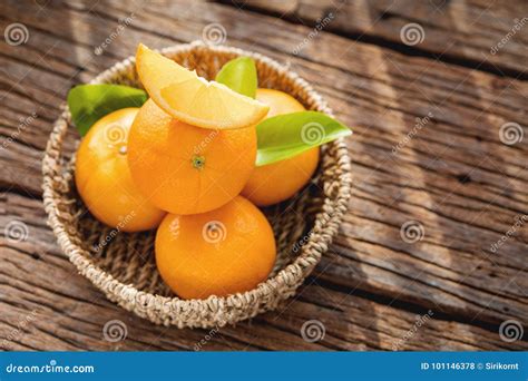 Fresh Orange Fruits In Basket On Wood Table Stock Photo Image Of