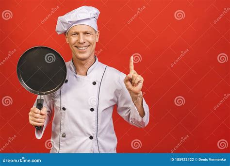 Image Of Joyful Senior Chief Man In Cook Uniform Smiling And Holding