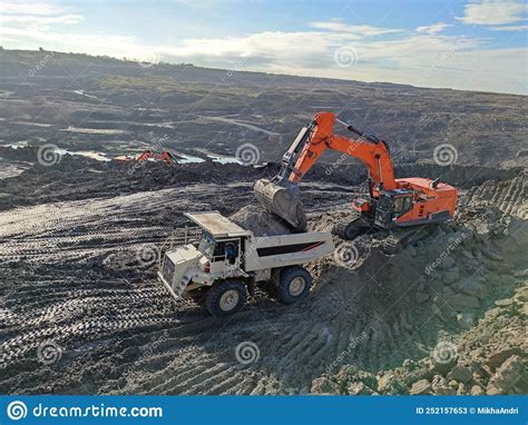 Excavator And Dump Truck Working In Coal Mine Area Stock Image Image