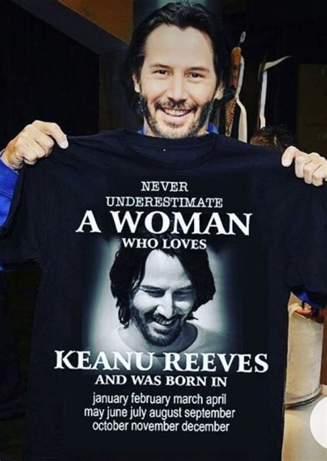 A Man Holding Up A T Shirt That Says Never Underestimate A Woman Who