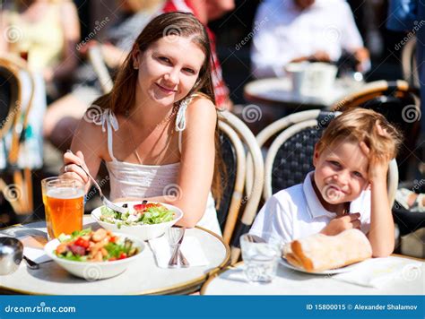 Mother And Son Having Lunch In Sidewalk Restaurant Stock Image Image