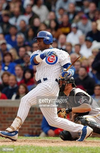 Sammy Sosa Of The Chicago Cubs Follows Through On His Swing After