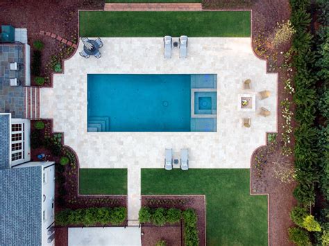 Geometric Pool Featuring A Raised Spa And Tanning Ledges