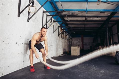 Men With Battle Rope Battle Ropes Exercise In Fitness Gym Stock Photo