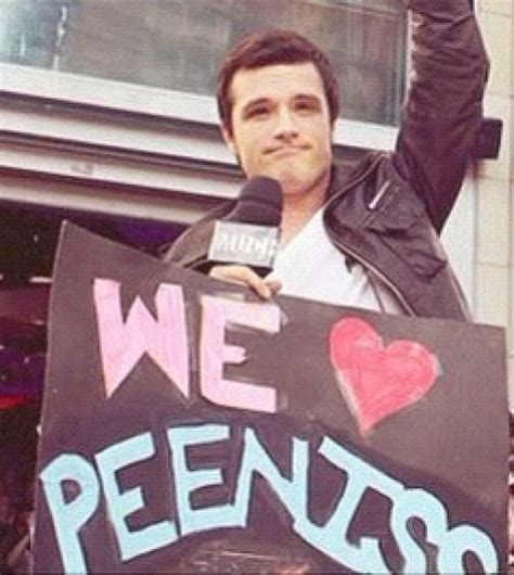 Josh Hutcherson Posing With A Sign Of Their Couple Name Katniss And