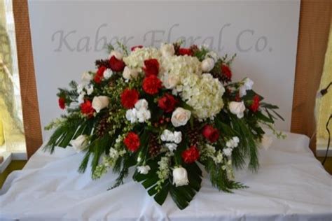 Winterish Casket Spray With Carnations Roses And White Hydrangea