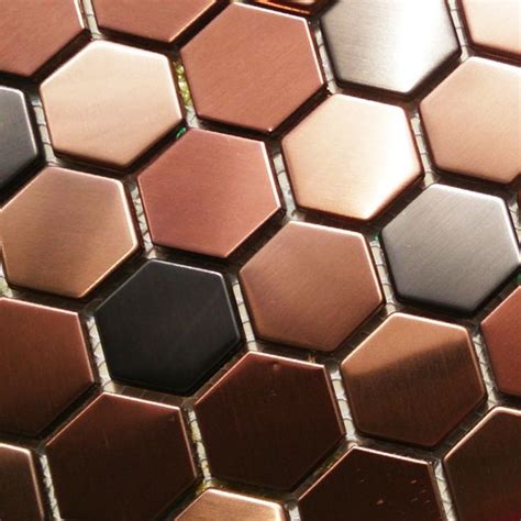 A Close Up View Of Some Shiny Metal Tiles With Different Colors And Shapes On Them