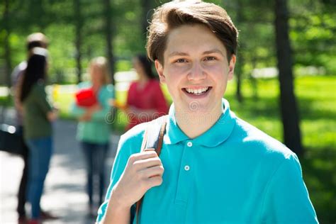 Portrait Of College Boy Holding Books Stock Photo Image Of Handsome