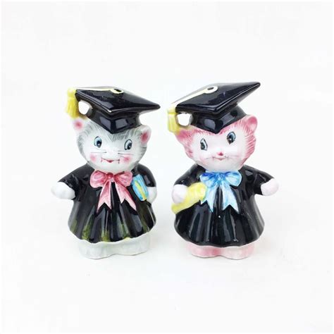 Two Ceramic Figurines Of Cats Wearing Graduation Caps And Gowns