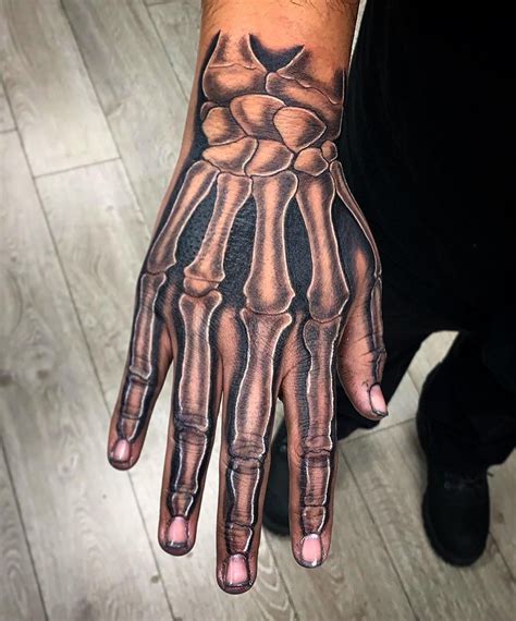 18 Terrifying And Cool Skeleton Hand Tattoos Design Psycho Tats