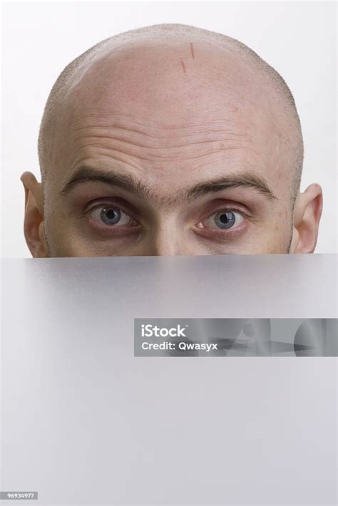 Man Peering Over A Cubicle Stock Photo Download Image Now Covering