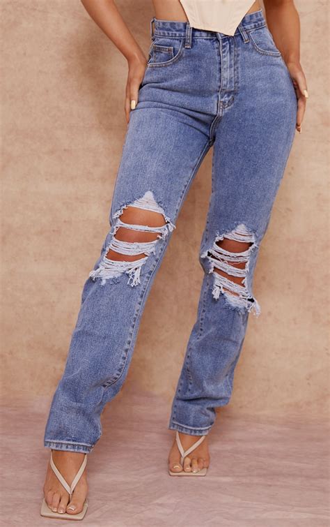 Mid Blue Wash Ripped Knee Long Leg Straight Jeans Prettylittlething